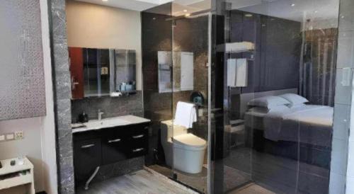 Ванная комната в Hanyong Hotel Shenzhen International Exhibition Center