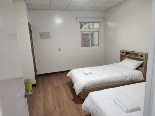 Postel nebo postele na pokoji v ubytování 豐濱客棧 Fakong Guest House