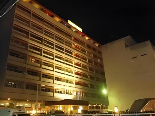 a large building at night with its lights on at Ubon Hotel in Ubon Ratchathani
