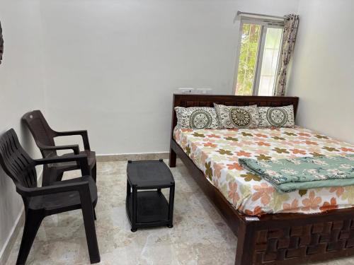 Кровать или кровати в номере ANNAMAIAH Home Stay, GUEST HOUSE & HOME STAY