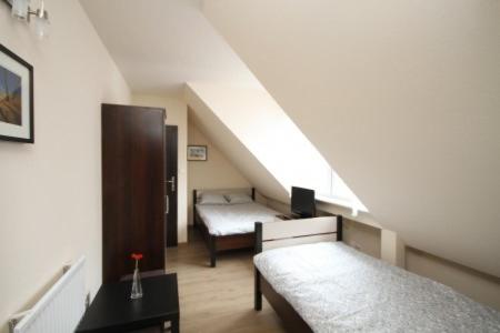 Llit o llits en una habitació de Ekonomiczne- Małe Pokoje Gościnne Dask Holiday