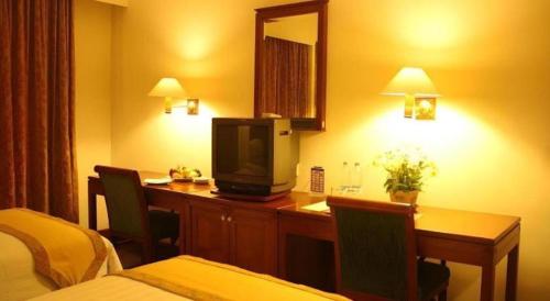 Кровать или кровати в номере Bumi Wiyata Hotel