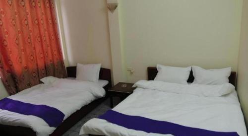 Postel nebo postele na pokoji v ubytování Halong Happy Hostel