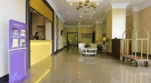 a large room with a pharmacyacistacistacistacist at Grand Darmo Suite by AMITHYA in Surabaya