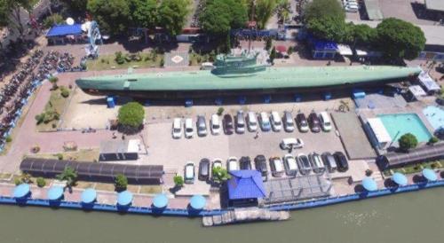 an aerial view of a building with a swimming pool at Grand Darmo Suite by AMITHYA in Surabaya