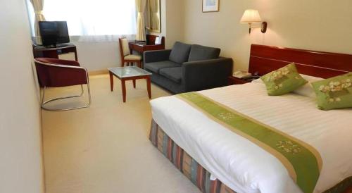 Ένα ή περισσότερα κρεβάτια σε δωμάτιο στο West Hotel