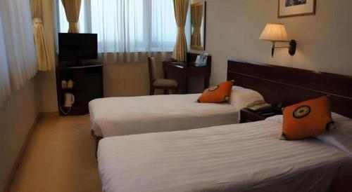 Ένα ή περισσότερα κρεβάτια σε δωμάτιο στο West Hotel
