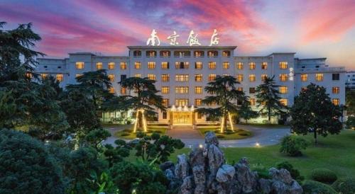 a rendering of a building with a sunset at Jin Jiang Nanjing Hotel in Nanjing