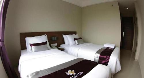 Кровать или кровати в номере Amantis Hotel
