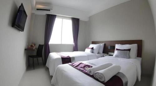 Кровать или кровати в номере Amantis Hotel