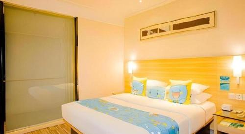 Letto o letti in una camera di City Comfort Inn Nanning Railway Station