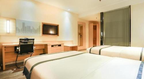 Letto o letti in una camera di City Comfort Inn Nanning Railway Station