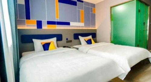 7 Days Inn Xi'an Railway Stationにあるベッド
