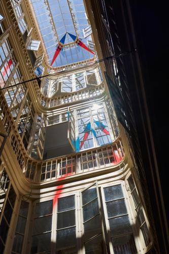 a ceiling with stained glass windows in a building at Cristine Bedfor Malaga Boutique Hotel in Málaga