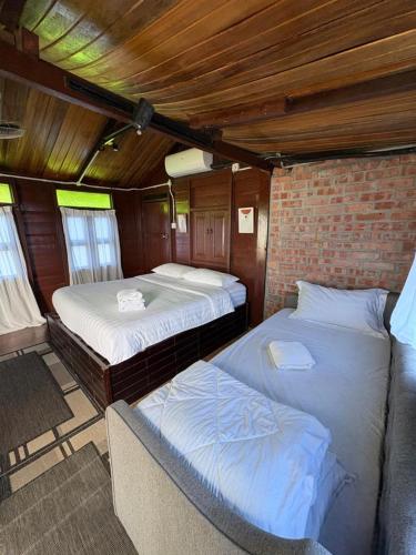 Postel nebo postele na pokoji v ubytování Cenanghill Beachfront