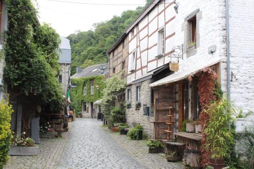 an alley in an old town with buildings at Bos Chalet Durbuy in Durbuy