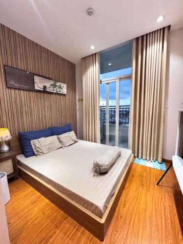 Postel nebo postele na pokoji v ubytování Lym HomeStay Long Xuyên