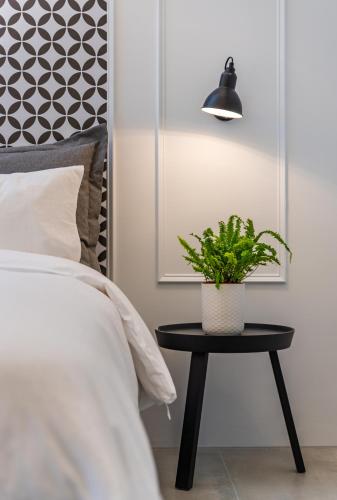 Ein Bett oder Betten in einem Zimmer der Unterkunft Olivia Boutique Hotel