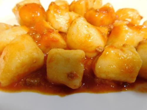 a pile of food on a plate with sauce at Albergo Alla Posta in Anduins