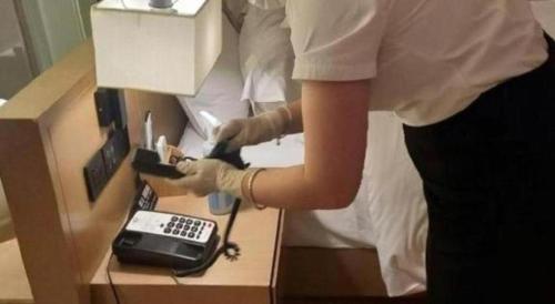 a person in a dental office with a telephone at V8 Ziyuangang Hotel in Guangzhou