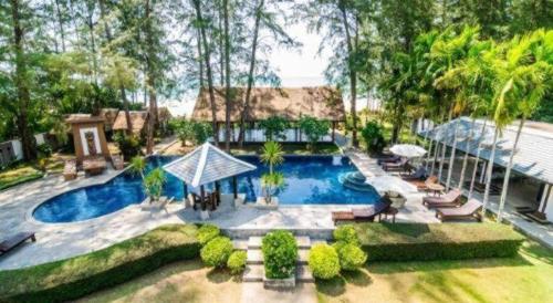 an overhead view of a swimming pool in a backyard at Ocean Breeze Residence in Khao Lak
