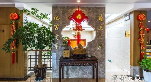 a room with a table in a building with signs on the wall at Huangshan Yupinglou Hotel in Huangshan