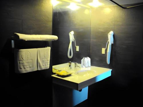 a bathroom with a sink and a mirror at Huu Nghi Hotel in Hai Phong