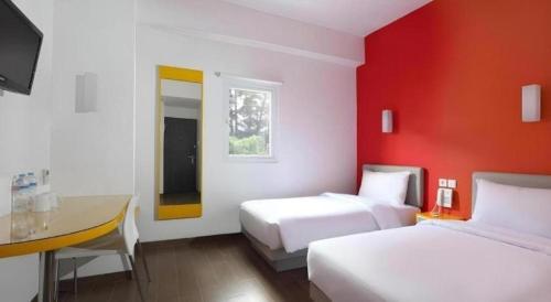 Кровать или кровати в номере Amaris Hotel Pakuan Bogor