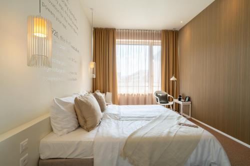 Una cama o camas en una habitación de Trafo Hotel Baden