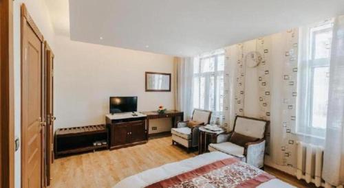 TV a/nebo společenská místnost v ubytování Mika Hotel