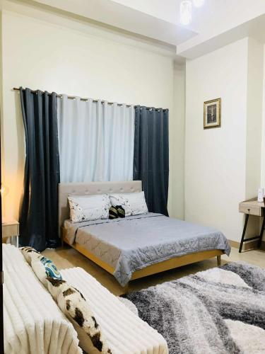 Postel nebo postele na pokoji v ubytování Unit 3J Signature Suites, Lafayette Megaworld