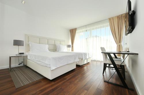 Ένα ή περισσότερα κρεβάτια σε δωμάτιο στο B&B Demar Residence & Dependance