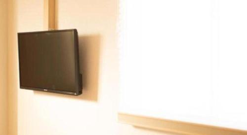 TV a/nebo společenská místnost v ubytování NAMBA EBISU HOTEL