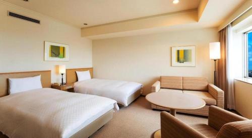 Un ou plusieurs lits dans un hébergement de l'établissement Century Royal Hotel Sapporo