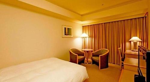 Un ou plusieurs lits dans un hébergement de l'établissement Century Royal Hotel Sapporo