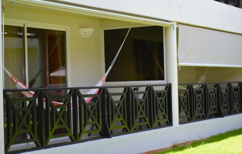 a balcony of a house with black railing at Savoy Hotel Boutique in Las Terrenas