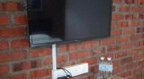 a brick wall with a window on it at Rock & Roll Hotel Klang in Klang