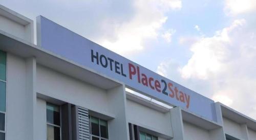 a hotel placeasyasy sign on the side of a building at Place2stay @ Campus Hub in Kuching