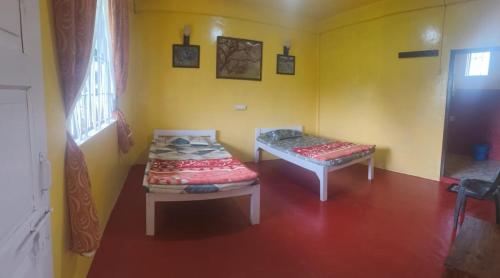 Ένα ή περισσότερα κρεβάτια σε δωμάτιο στο D Cloud Guesthouse