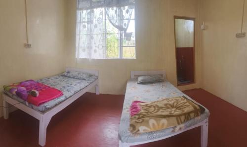 Postel nebo postele na pokoji v ubytování D Cloud Guesthouse