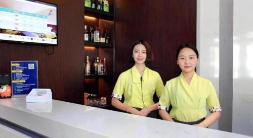 two women standing at a counter in a bar at Zmax Changzhi Bayi Square in Changzhi