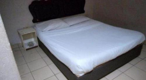 Katil atau katil-katil dalam bilik di OYO 90376 Centre Point Hotel
