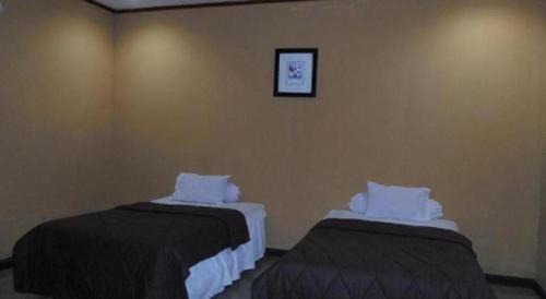 Кровать или кровати в номере Hotel Bunga Pantai