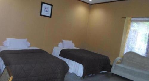 Кровать или кровати в номере Hotel Bunga Pantai