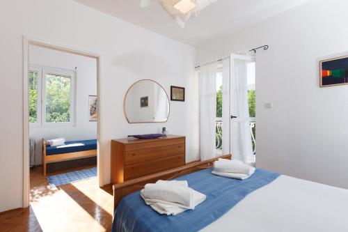 En eller flere senge i et værelse på Apartment Dubica