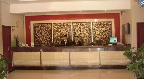 a lobby with a counter with a counter sidx sidx sidx at GreenTree Inn Linyi Bus Station in Linyi