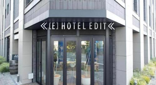 a building with a sign on the front of it at Hotel Edit Yokohama in Yokohama