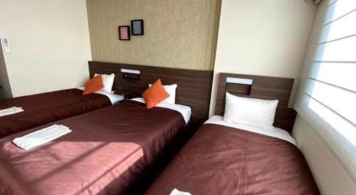 Кровать или кровати в номере HOTEL BAYGULLS