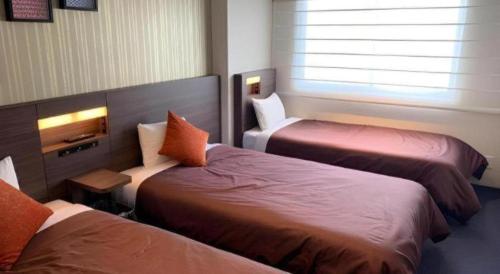 Кровать или кровати в номере HOTEL BAYGULLS