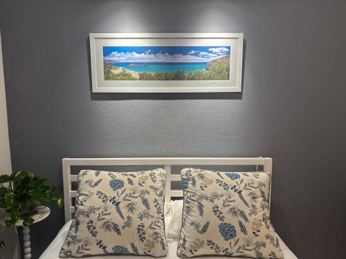a picture hanging above a bed with two pillows at Tokyo Disney Resort 3 minutes by train, along Symbol Road, and plenty of commercial facilities!Free wifi, double bed in Tokyo